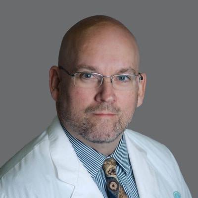 A headshot of E. Wayne Sparks, MD