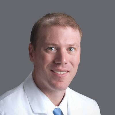 A headshot of Timothy B. Miller, MD